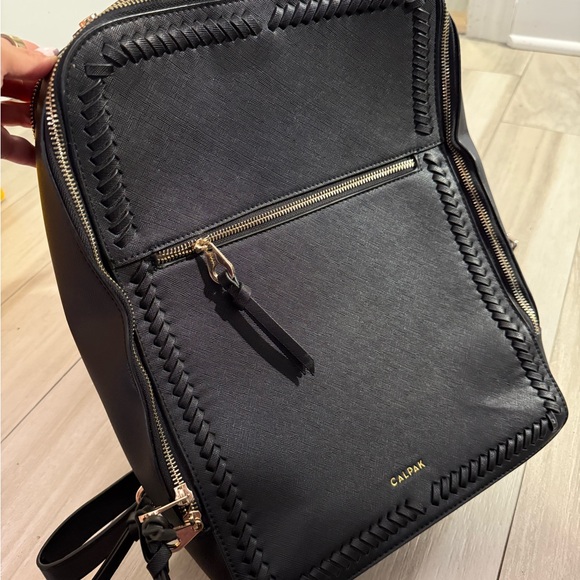 Calpak Black Backpack with Sleek Design and Gold Accents - Picture 3 of 4